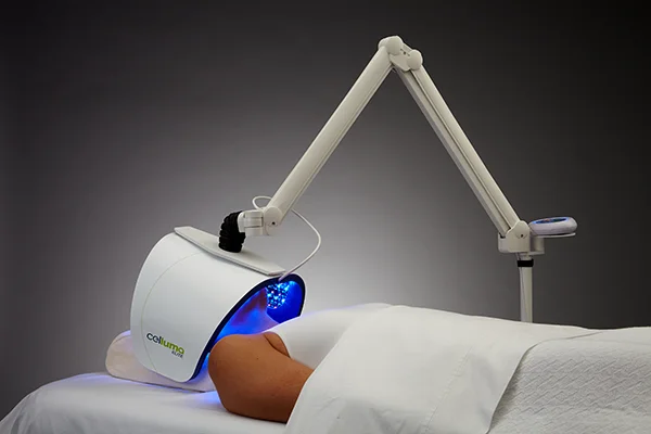 Functional Medicine Toms River NJ Celluma Blue Light on Face A patient laying down while Celluma blue light is applied to their face for acne treatment