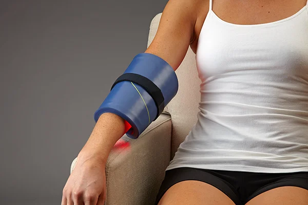Functional Medicine Toms River NJ Celluma on Elbow A patient with arm pain is being treated by Celluma applied directly to her arm