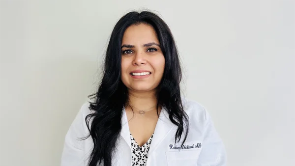 Functional Medicine Toms River NJ Harleen Dhaliwal HP About A professional photo of Dr. Harleen Dhaliwal wearing a white lab coat